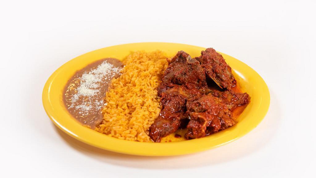 Birria De Chivo · Goeat stew with side of rice and beans.
