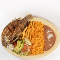 Mojarra Frita · Deep fried whole fish served with rice and beans.
