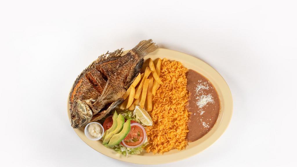 Mojarra Frita · Deep fried whole fish served with rice and beans.