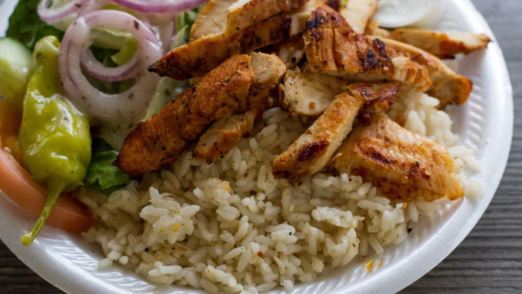Chicken Gyro Plate · Chicken, rice, Greek salad, pita, garlic sauce.
