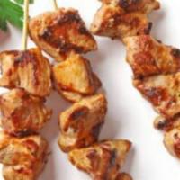 Chicken Shish Kabab Plate · Skewered chicken, rice, Greek salad, pita, garlic sauce.