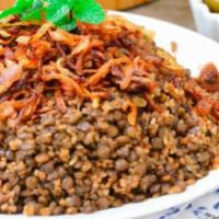 Mujaddara Plate · Vegan. Rice and lentils, tabouleh salad, falafel, pita.
