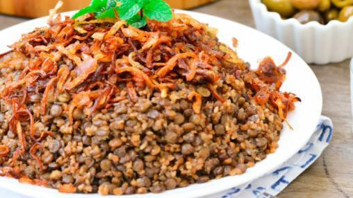 Mujaddara Plate · Vegan. Rice and lentils, tabouleh salad, falafel, pita.