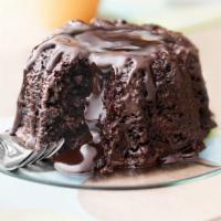 Molten Chocolate Cake · Our moist dark chocolate cake enrobed with dark chocolate  filled with a dark chocolate tru...