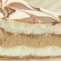 Dulce De Leche Cheesecake · Creamy, sweet white chocolate cheesecake marbled and layered with a rich, dulce-flavored che...