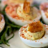 Deviled Eggs · Whipped Egg Yolks, topped with Chicken Skin, Dill & Smoked Paprika