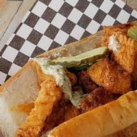 Charles Po-Boy · Southern Fried chicken, lettuce, tomato, pickles, and house-made remoulade sauce on a 10