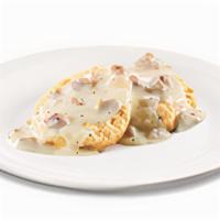 Biscuit And Gravy · An open-faced biscuit covered in sausage gravy
