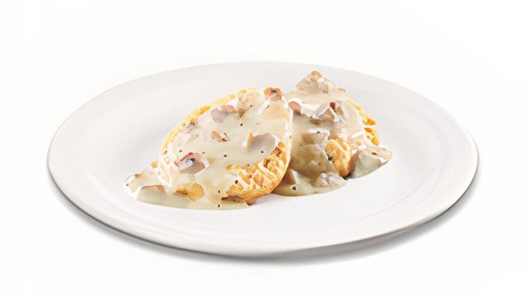 Biscuit And Gravy · An open-faced biscuit covered in sausage gravy