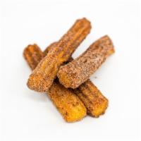 Churros · Two classic churros. Perfect sweet compliment to a savory breakfast burrito.