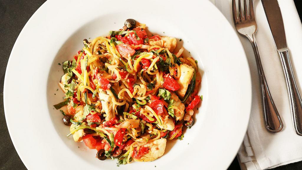 Zoodles Vegetale · Fresh zucchini ribbons sautéed with onions, garlic, fire roasted tomatoes, tossed with artichoke hearts, sun dried tomatoes, black olives and capers. Topped with fresh basil.