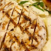 Chicken Alfredo Pasta · Grilled chicken on top of creamy Alfredo sauce and penne pasta served with a housemade bread...