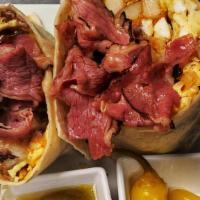 Pastrami Breakfast Burrito · Homestyle potatoes, savory pastrami meat, scrambled eggs and cheddar cheese, wrapped in a 1f...