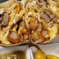 Sausage Breakfast Burrito · Homestyle potatoes, sausage, scrambled eggs and cheddar cheese, wrapped in a flour tortilla.