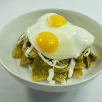 Chilaquiles · 2 eggs any style, mole rojo or verde, onion, sour cream, cotija, micro cilantro