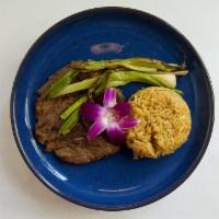 Carne Asada · 8 oz ranchero cut, salsa verde, grilled spring onion, served with house rice and beans and f...