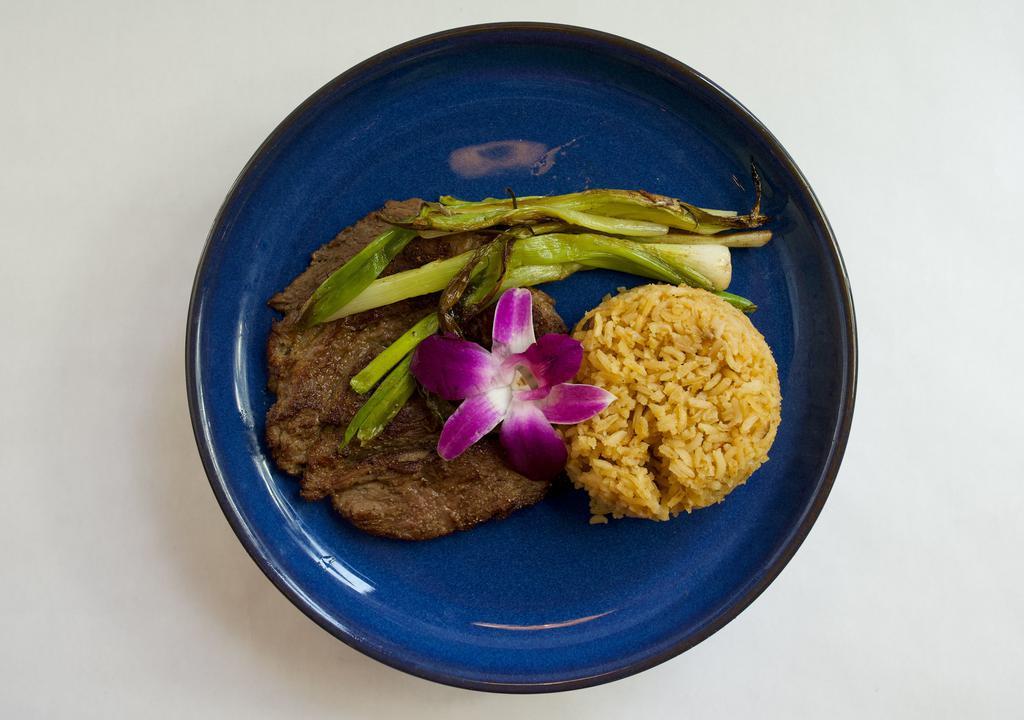 Carne Asada · 8 oz ranchero cut, salsa verde, grilled spring onion, served with house rice and beans and fresh corn tortillas