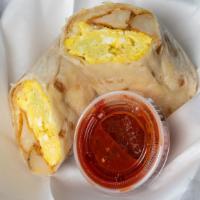 Egg & Potato Burrito · Scrambled eggs , potato cubes , cheese .