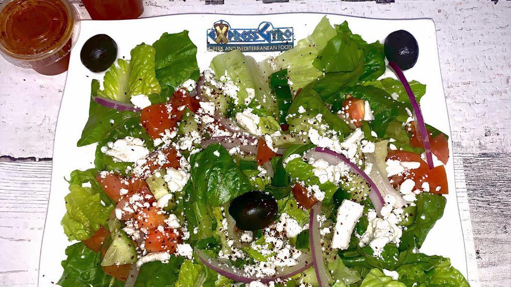 Greek Salad · Romaine lettuce, onion, tomato, cucumber, kalamata olives, feta cheese with Greek vinaigrette dressing.