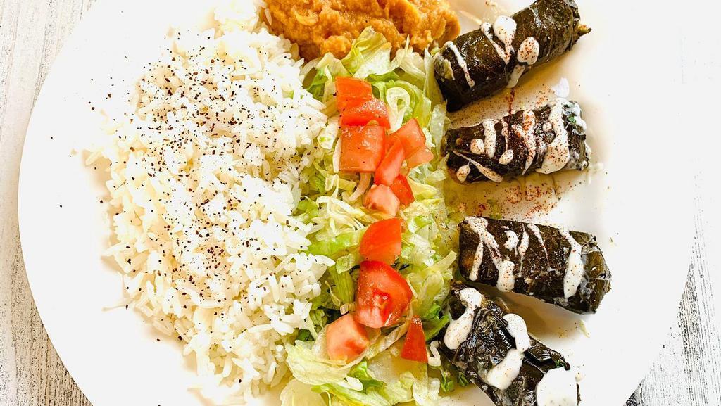Dolmas Plate · Vegetarian. Grape leaves stuffed with rice and spices.(5pcs Dolmas)