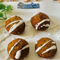 Falafel (4 Pcs.) · Gluten-free. Fried chickpeas mixed with herbs and spices, topped with tzatziki sauce.