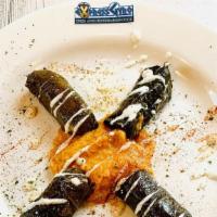 Dolmas (4 Pcs.) · Gluten-free. Grape leaves stuffed with rice and spices. It comes with a choice of starter an...