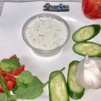 Small Tzatziki (3.25Oz) · Greek Yogurt mixed with cucumber ,garlic ,olive oil and spice/herbs