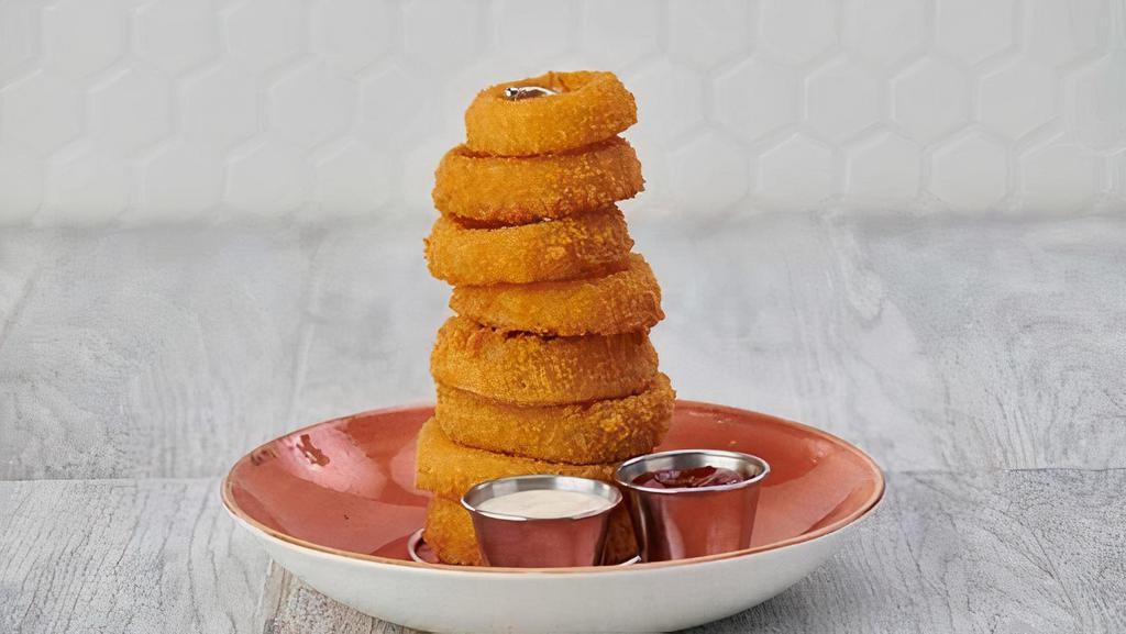 Onion Ring Tower · Our signature crispy onion rings perfectly seasoned and served with barbecue and ranch sauce.
