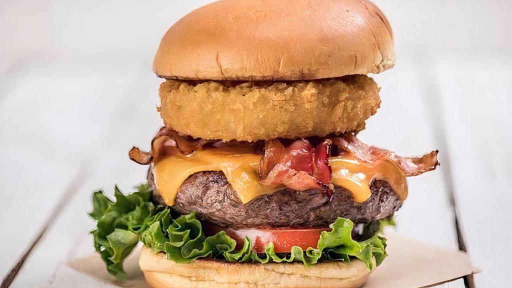 Original Legendary Burger · The burger that started it all! Steak burger, with applewood bacon, cheddar cheese, crispy onion ring, leaf lettuce, and vine-ripened tomato served with seasoned fries.