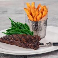 New York Strip Steak · USDA choice 12 oz New York strip steak, grilled and topped with herb butter, served with Yuk...