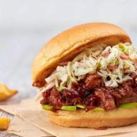 Bbq Pulled Pork Sandwich · Tender pulled pork with our house-made bbq sauce, pickles, and coleslaw served with seasoned...