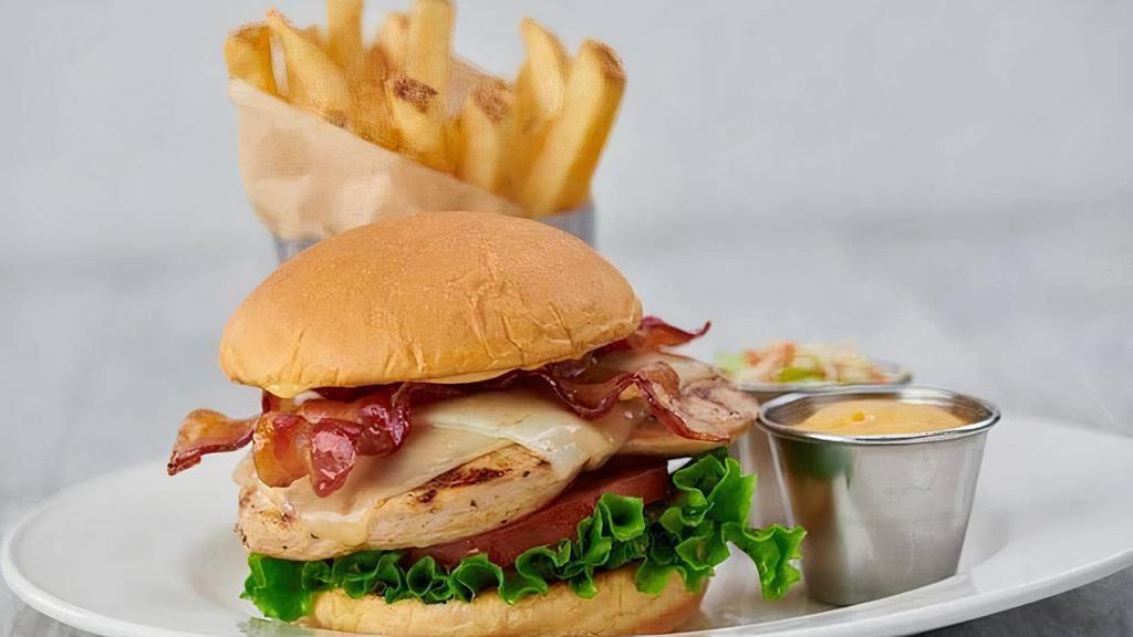 Grilled Chicken Sandwich · 8 oz. grilled chicken with melted Monterey Jack cheese, applewood bacon, leaf lettuce and vine ripened tomato, served on a toasted fresh bun with honey mustard, served seasoned fries.