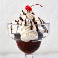 Hot Fudge Brownie · Warm chocolate brownie topped hot fudge, chocolate sprinkles, fresh whipped cream, and a che...