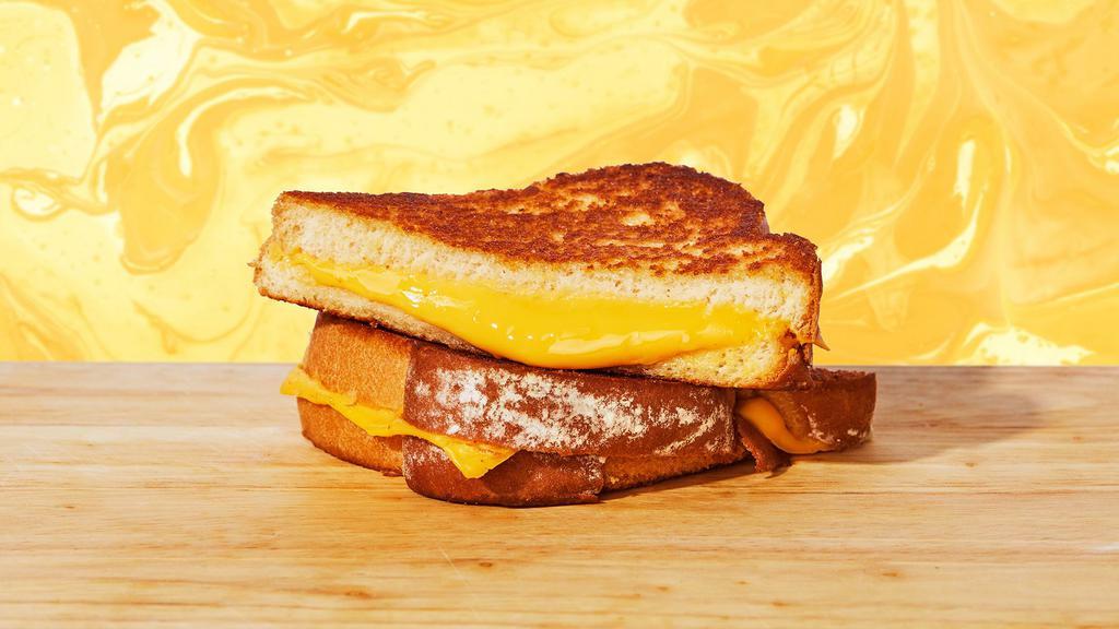 Classic Grilled Cheese · Do we even have to tell you? Melty American cheese between two slices of buttery grilled bread.