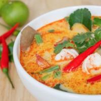 Tom Yum Soup · Tom Yum Soup - A distinct traditional Thai hot and sour flavored soup with fragrant spices a...