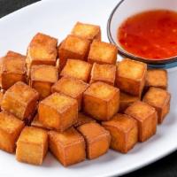 Crispy Tofu (6 Pcs.) · Battered tofu with crispy skin served with our sweet and sour sauce.