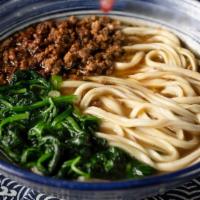 Dan Dan Noodle · Spicy. Seasoned ground pork served with fresh spinach in a traditional light beef broth.