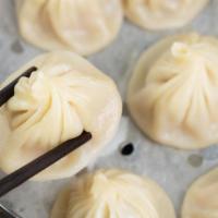 Juicy Pork Buns (8 Pcs.) · Steamed buns filled with juicy, savory ground pork served with housemade dumpling sauce.
