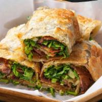Beef Roll Pancake (4 Pcs.) · A thin fried flour pancake encasing slices of beef, green onions, cilantro and hoisin sauce.