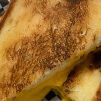 Grilled Cheese · 3-Slices of American Cheese on Sliced Bread.