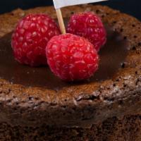 Gluten Free Flourless Chocolate Cake · Gluten Free dark chocolate flourless cake topped with chocolate ganache and fresh berries.