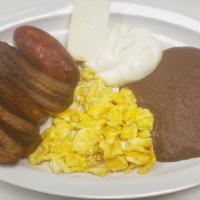 Desayuno Tipico Plate · comes with 2 eggs your choice of over easy or scrambled 1 sausage platano  
cheese and cream
