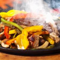 Chicken Fajita · Popular items. Served with bell peppers, onions and tomatoes, also a separate platter is ser...