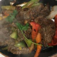 Grass Fed Sirloin Steak Fajitas · Served with bell peppers, onions and tomatoes, also a separate platter is served on the side...