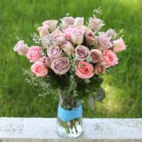 Pink And Pale Roses Bouquet · Pink and Pale Roses Bouquets with greenery in a clear glass vase.