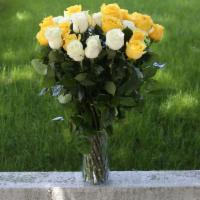 White And Yellow Roses Bouquet · White and Yellow Roses Bouquet ( 24 stems)  in a clear glass vase.