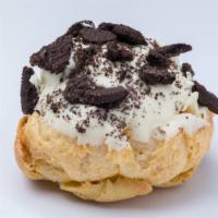 Cookies & Cream Éclair · Dipped in rich white chocolate and sprinkled with Oreo cookie bits!