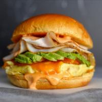 Brioche, Bacon, Sausage, Egg & Cheddar Sandwich · 2 scrambled eggs, melted Cheddar cheese, smoked bacon, breakfast sausage, and Sriracha aioli...