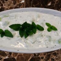 Mast O' Khiar (V) · Traditional Persian yogurt and cucumber dip that is light and flavorful served with main dis...