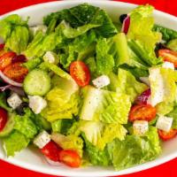Greek Salad · Crisp lettuce, feta cheese, tomatoes, cucumbers and kalamata olives.